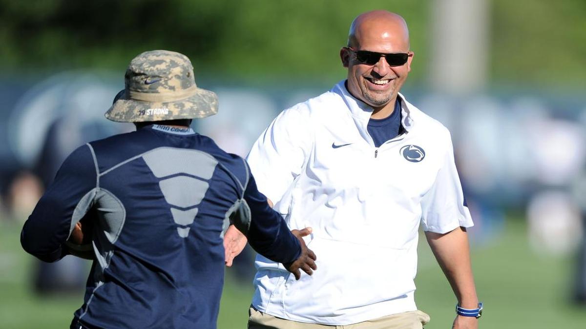 Penn State football coach James Franklin, right, high-fives Penn State running back Mark Allen during the Penn State Football Elite Camp I on Saturday, June 3, 2017, at the Lasch fields.
