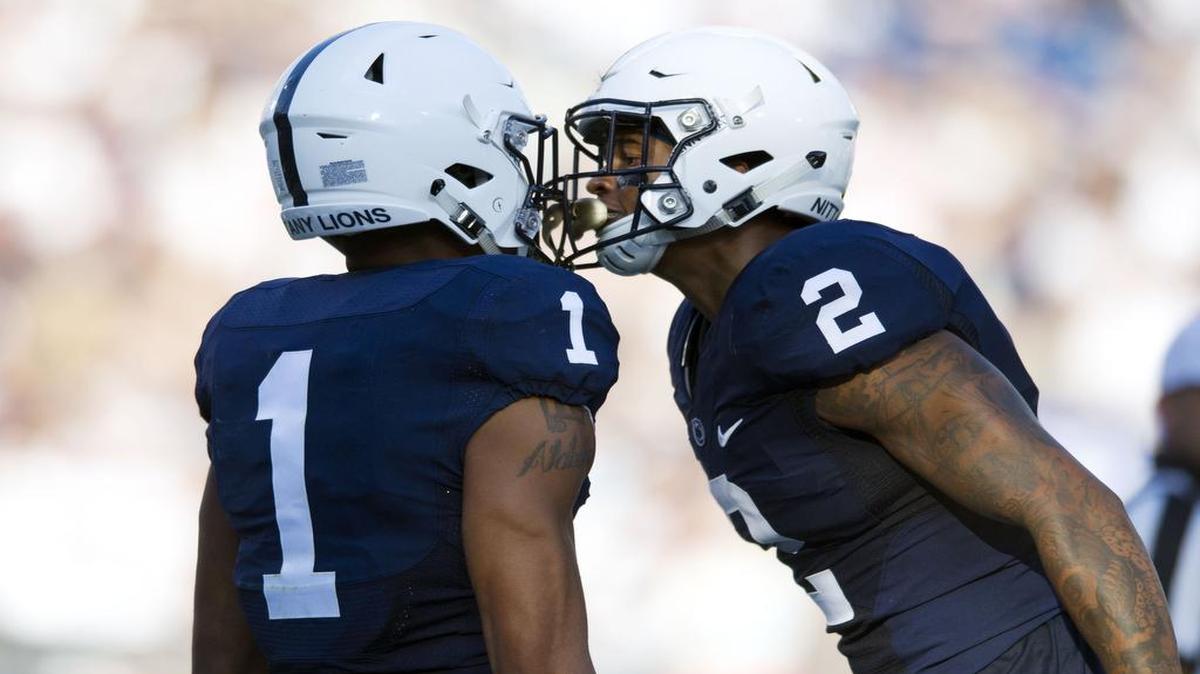 Penn State safety Marcus Allen, right, cheers on cornerback Christian Campbell during a game last season. Campbell and the rest of the cornerbacks’ production has been impressive through the first two weeks of the season.