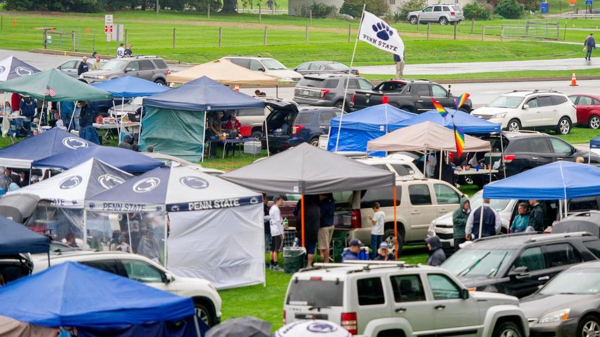 Tailgaters brave the rain outside of Beaver Stadium before the Saturday, October 8, 2016 game vs. Maryland. Some grass lots will be closed for Saturday night’s game vs. Ohio State.