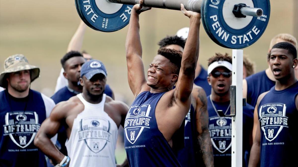 Cornerback Garrett Taylor competes in the overhead press during Penn State football’s 14th Annual Lift for Life on Saturday.