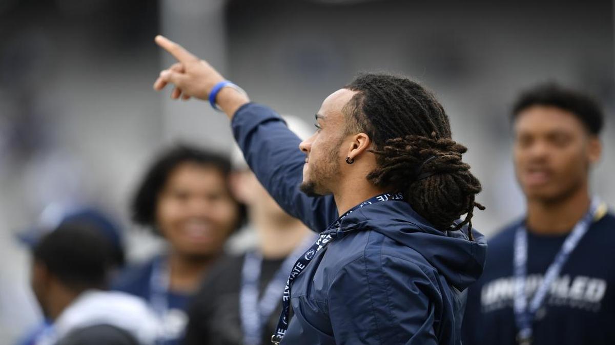 Incoming Penn State safety Jonathan Sutherland points to fans before the Blue-White Game on April 22 at Beaver Stadium. Sutherland is an Ontario native who always dreamed of playing college football in the U.S.