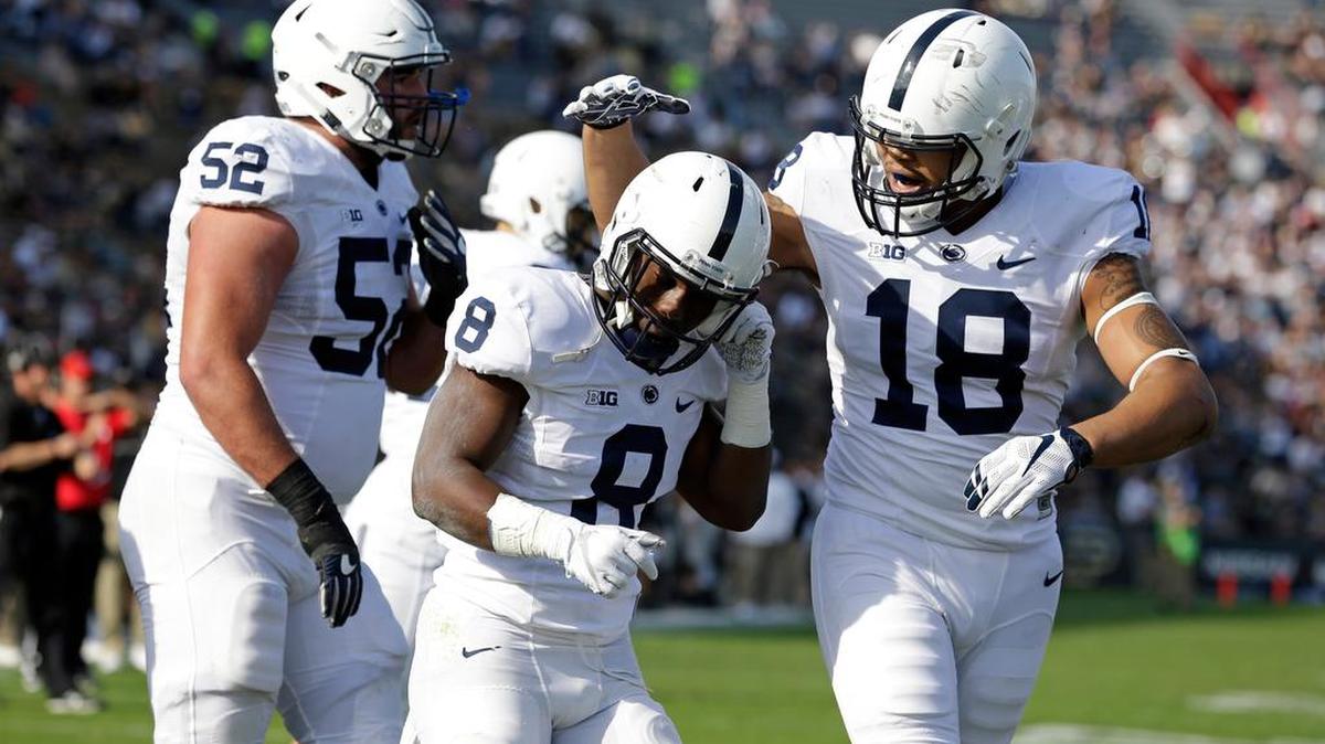 Penn State running back Mark Allen (8) celebrates a touchdown against Purdue with tight end Jonathan Holland (18) during the second half of an NCAA college football game in West Lafayette, Ind., Saturday, Oct. 29, 2016. Penn State defeated Purdue 62-24. (AP Photo/Michael Conroy)