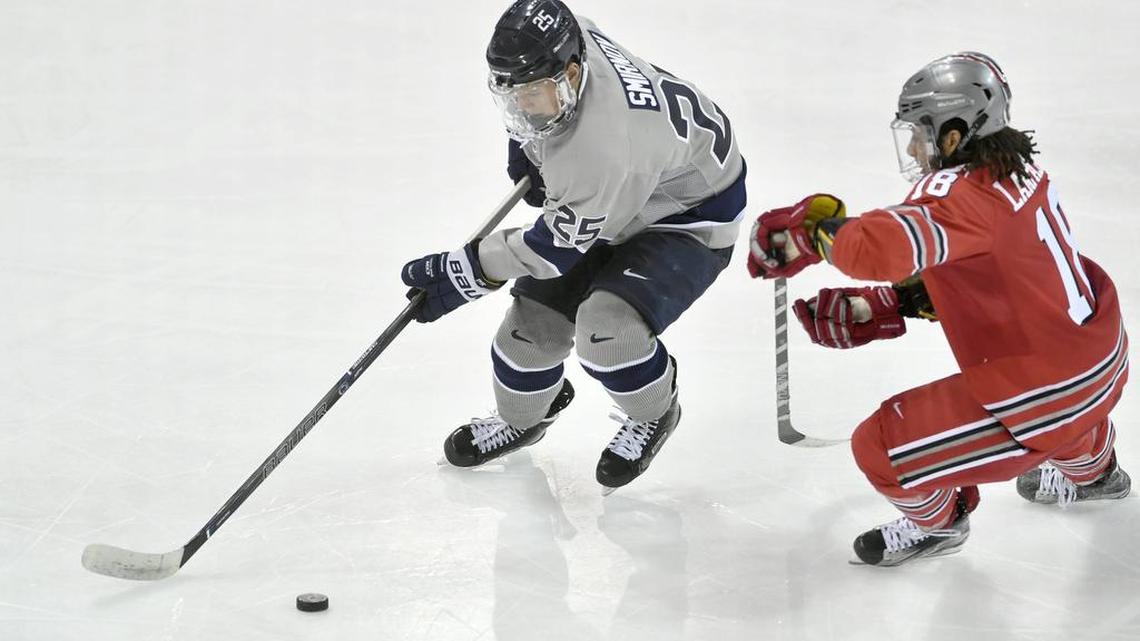Penn State's Denis Smirnov skates around Ohio State's Christian Lampasso during the Saturday, January 21, 2017 at Pegula Ice Arena. Ohio State beat Penn State, 6-3 to sweep the series.