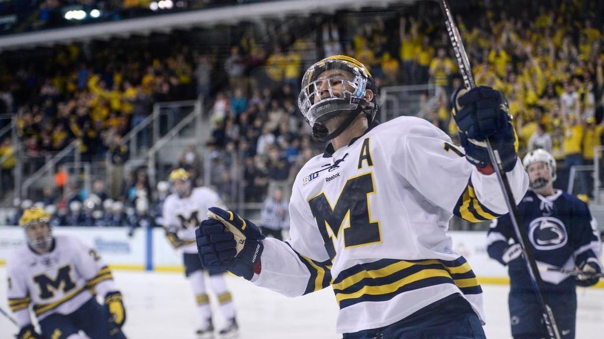 Michigan’s Cristoval Nieves (12) celebrates after scoring goal during the Wolverines’ 7-1 win against Penn State at Yost Ice Arena on Friday in Ann Arbor, Mich.