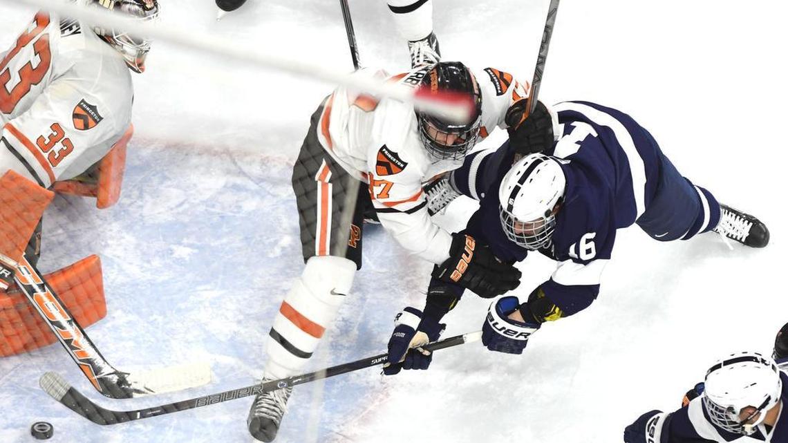Penn State’s Andrew Sturtz (16) scores the fourth goal of the game against Princeton goaltender Colton Phinney during Saturday’s game in Philadelphia.