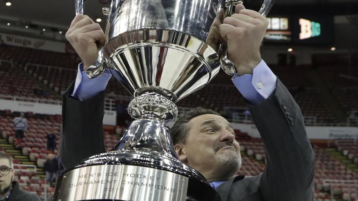 Penn State coach Guy Gadowsky, seen here holding the Big Ten trophy after defeating Wisconsin 2-1 in two overtimes, said that the conference is getting “tougher and tougher and better and better.”