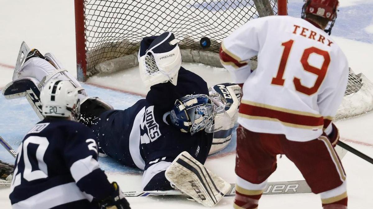 Penn State goalie Peyton Jones (31) falls to the ice as Denver’s Troy Terry (19) scores in the second period during the midwest regional final of the NCAA college hockey tournament on Sunday in Cincinnati.