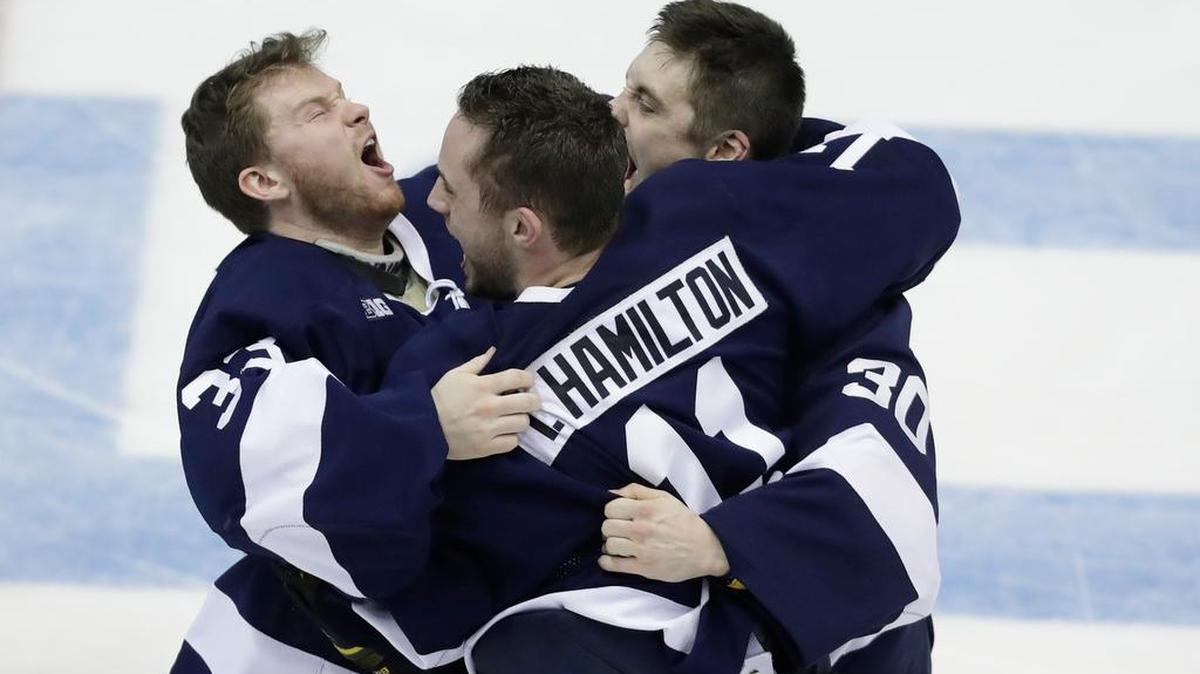 Penn State goalie Chris Funkey (33), defenseman Trevor Hamilton (11) and goalie Matt Erlichman (30) celebrate after Penn State defeated Wisconsin 2-1 in the final in the Big Ten tournament. It was a high point in a season that also saw the Nittany Lions reach the No. 1 ranking.