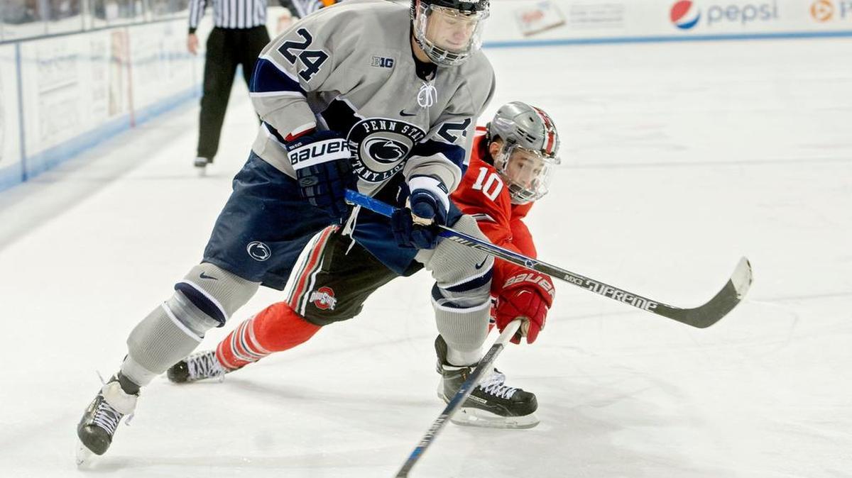 Ohio State’s John Wiitala tries to steal the puck from Penn State’s Vince Pedrie during the Saturday, February 20, 2016, game at Pegula Ice Arena. Ohio State won, 7-4.
