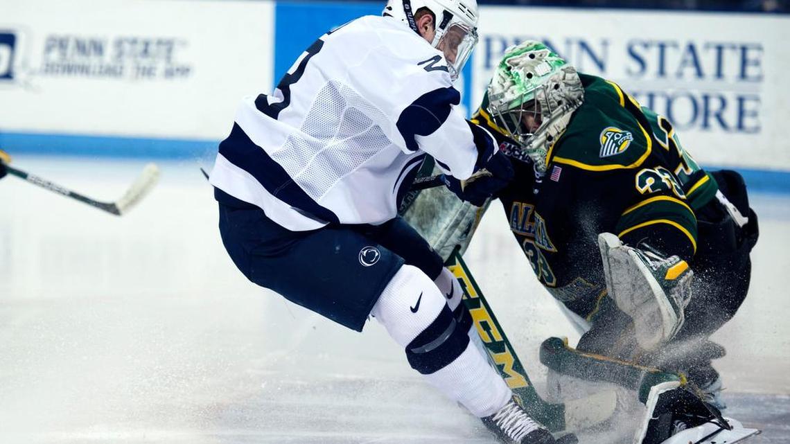 Penn State forward Alec Marsh collides with Alaska goalie Olivier Mantha during a game Friday at Pegula Ice Arena.