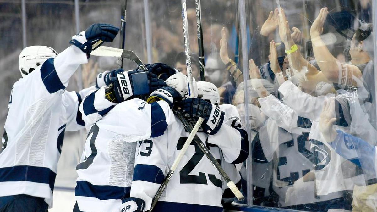 Penn State hockey celebrates Blake Gober's open net goal during the season opener against St Lawrence on Oct. 6 at Pegula Ice Arena.