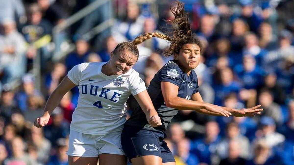 Duke’s Ashton Miller (4) and Penn State’s Raquel Rodriguez (11) jump for the ball during the first half of the NCAA Women's College Cup soccer final in Cary, N.C., Sunday, Dec. 6, 2015.