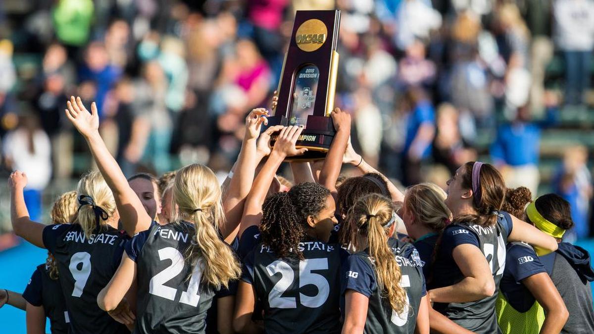 The Penn State women’s soccer team celebrates with the trophy after winning last year’s final against Duke. The Nittany Lions will begin their road to defending their national title Friday against Bucknell.