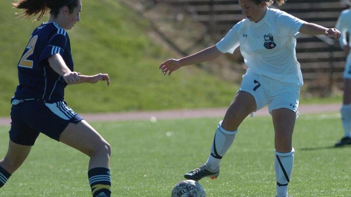 State College's Megan Ritchey (7) controls the ball against Mt. Lebanon's Kate Touscany, left, in 2010.