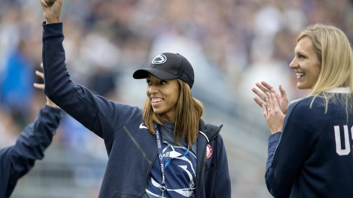 USA volleyball players in the Rio Olympics and Penn State Volleyball alums Alisha Glass, left, and Christa Harmotto Dietzen wave to the crowd during the Penn State football game on Saturday in Beaver Stadium.