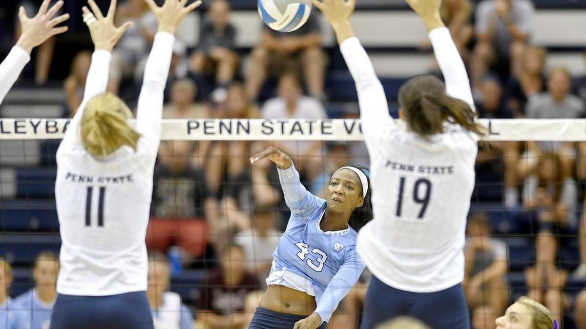 North Carolina's Taylor Leath hits the ball past Penn State defenders Tori Gorrell and Heidi Thelen during the Saturday, August 27, 2016 game in Rec Hall. Leath was a former State College Area stand out.