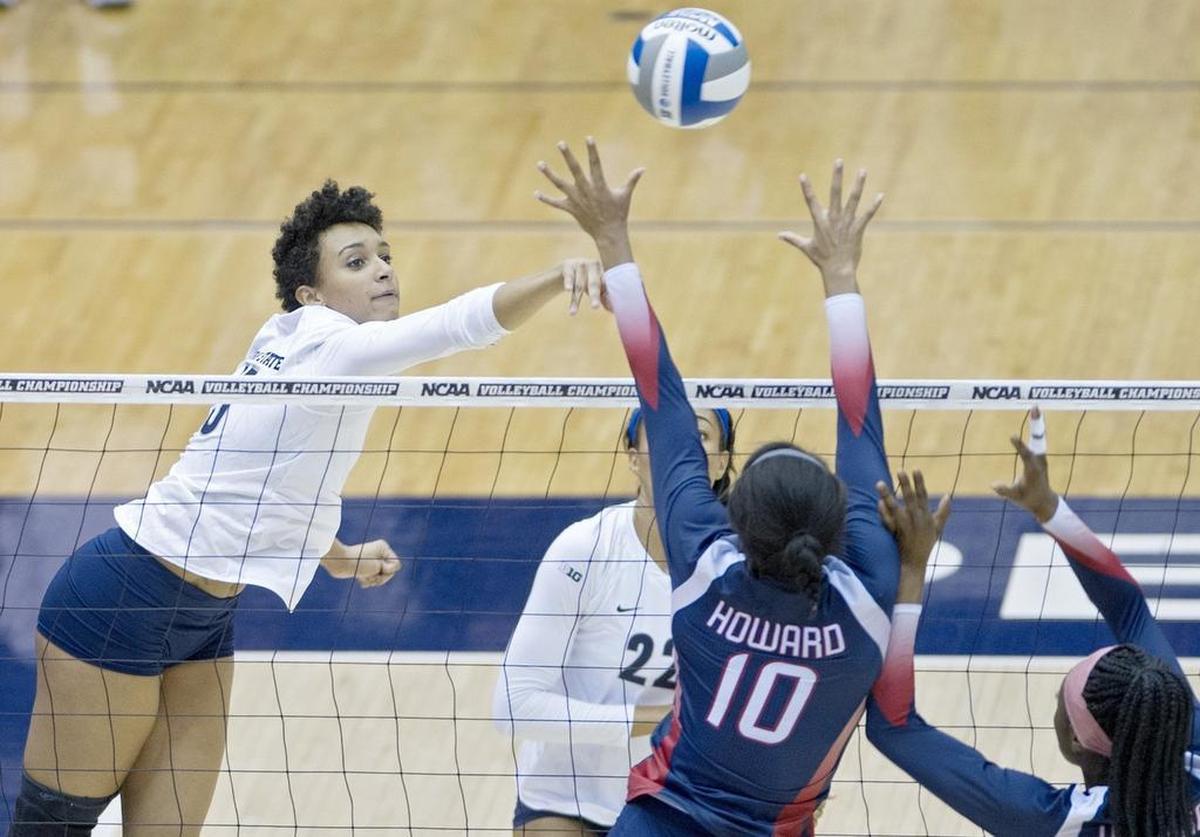 Penn State’s Haleigh Washington hits the ball over Howard’s Khaila Donaldson during the Dec. 4, 2015 NCAA women’s volleyball tournament first round match.