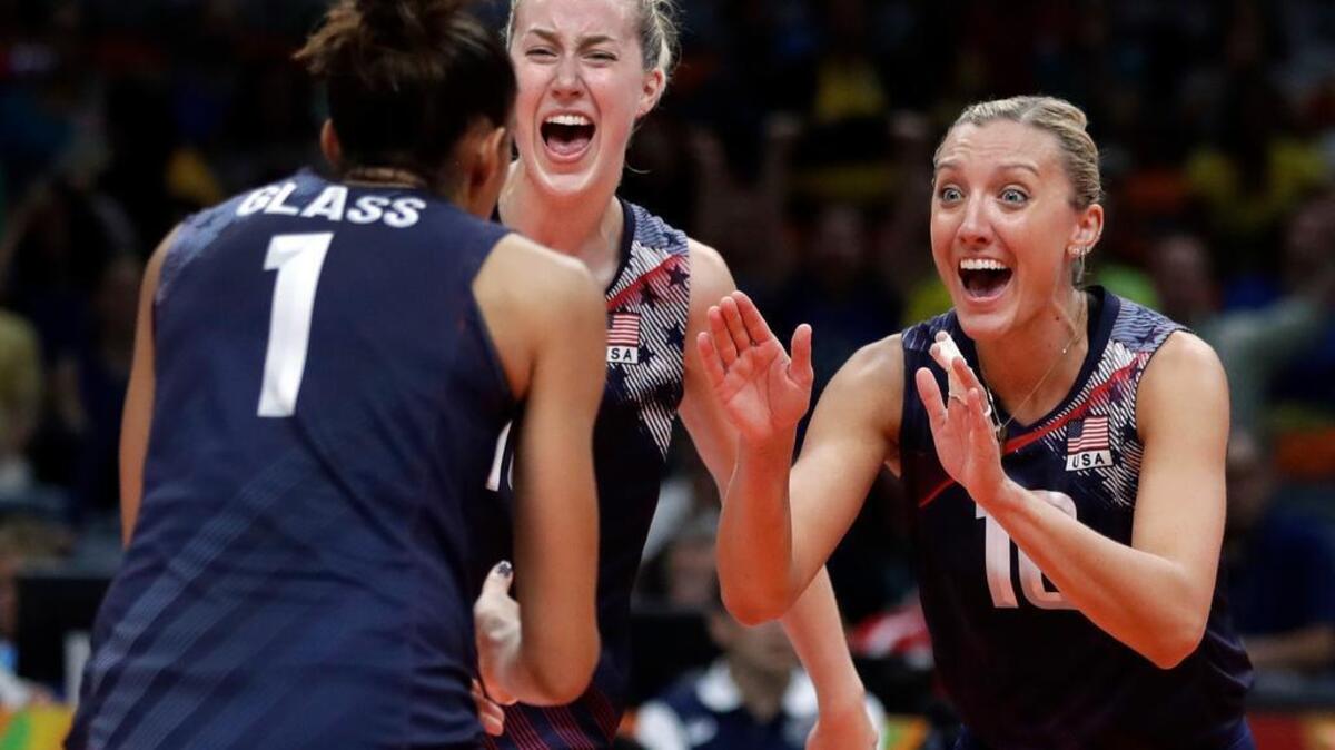 Alisha Glass (1), setter for the U.S. women’s volleyball team and a former Penn State standout, celebrates a point with teammates Jordan Larson, right, and Kim Hill during a women’s quarterfinal volleyball match against Japan at the 2016 Summer Olympics in Rio de Janeiro, Brazil, Tuesday, Aug. 16, 2016.