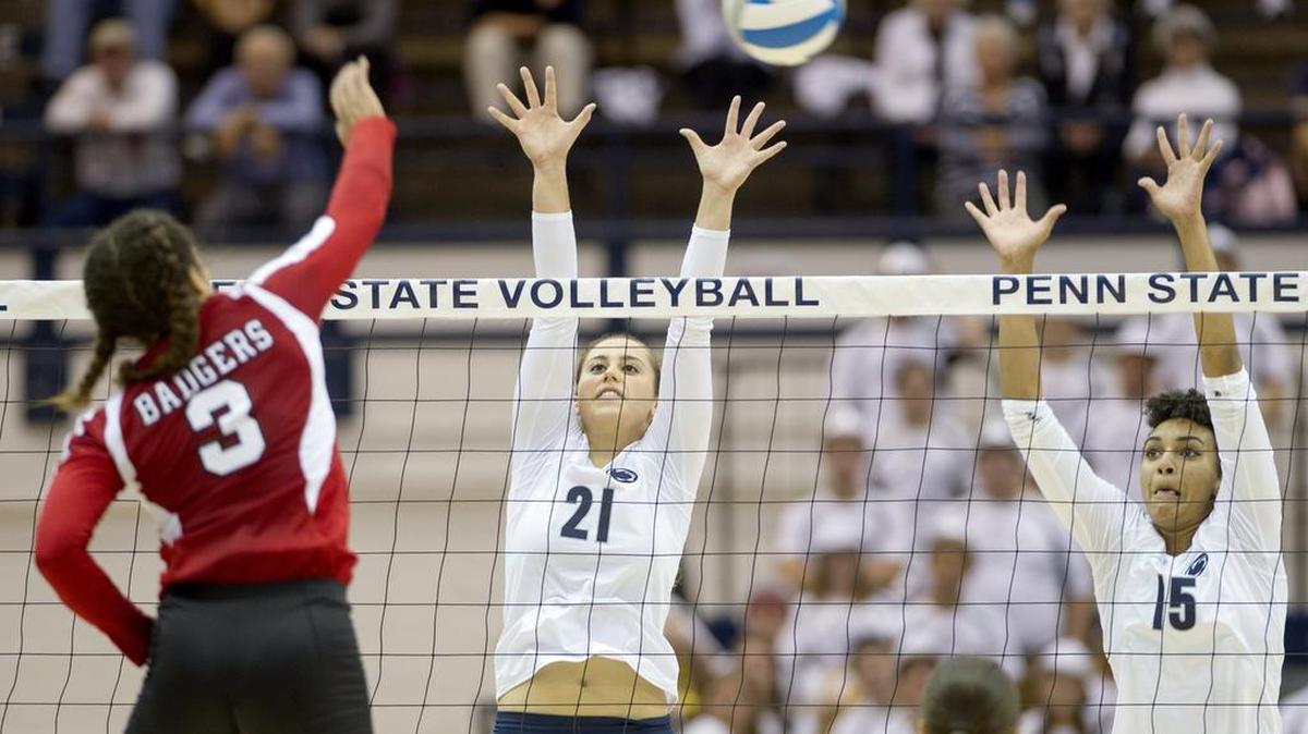 Penn State’s Bryanna Weiskircher (21) and Haleigh Washington jump to block a hit by Wisconsin’s Lauryn Gillis during the September 23, 2015 game at Rec Hall. The Nittany Lions won, 25-21, 25-16 and 25-20.
