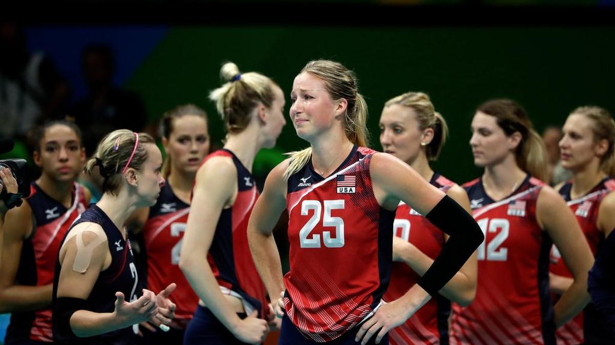 The United States’ Karsta Lowe (25) and her teammates react after losing in the women's volleyball semifinal to Serbia 3-2 on Thursday. Also on the team are Penn State alumni Alisha Glass, far left, and Christa Harmotto Dietzen, far right.