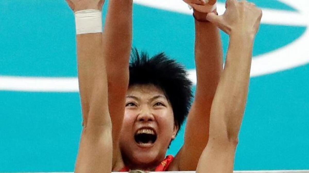 China’s Yuan Xinyue spikes the ball as the United States’ Christa Dietzen blocks during a women’s preliminary volleyball match at the 2016 Summer Olympics in Rio de Janeiro, Brazil, Sunday, Aug. 14, 2016. (AP Photo/Matt Rourke)