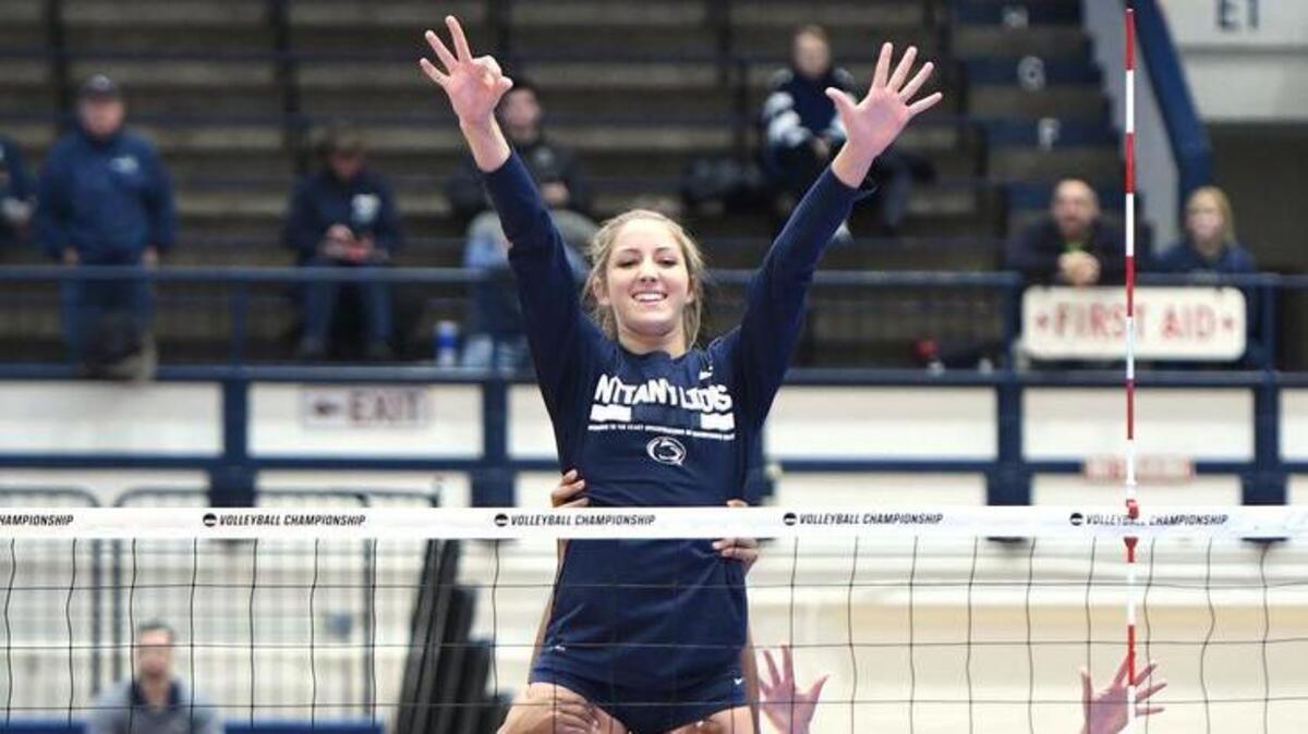 Penn State sophomore Emily Sciorra is lifted above the net by teammates, from left, Simone Lee, Haleigh Washington and Nia Reed during warm-ups before Saturday’s match at Rec Hall. The quick lift has taken place before every match, home and away, for more than a dozen years and is one of many rituals then team does to stay loose and have fun.