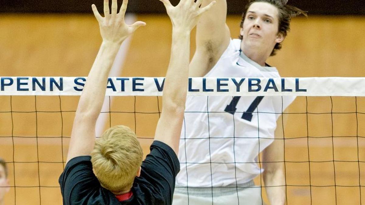 Penn State’s Matt Callaway hits the ball over USC’s Tommy Leonard during the match on Thursday in Rec Hall. Penn State won 25-22, 27-25, 29-27.