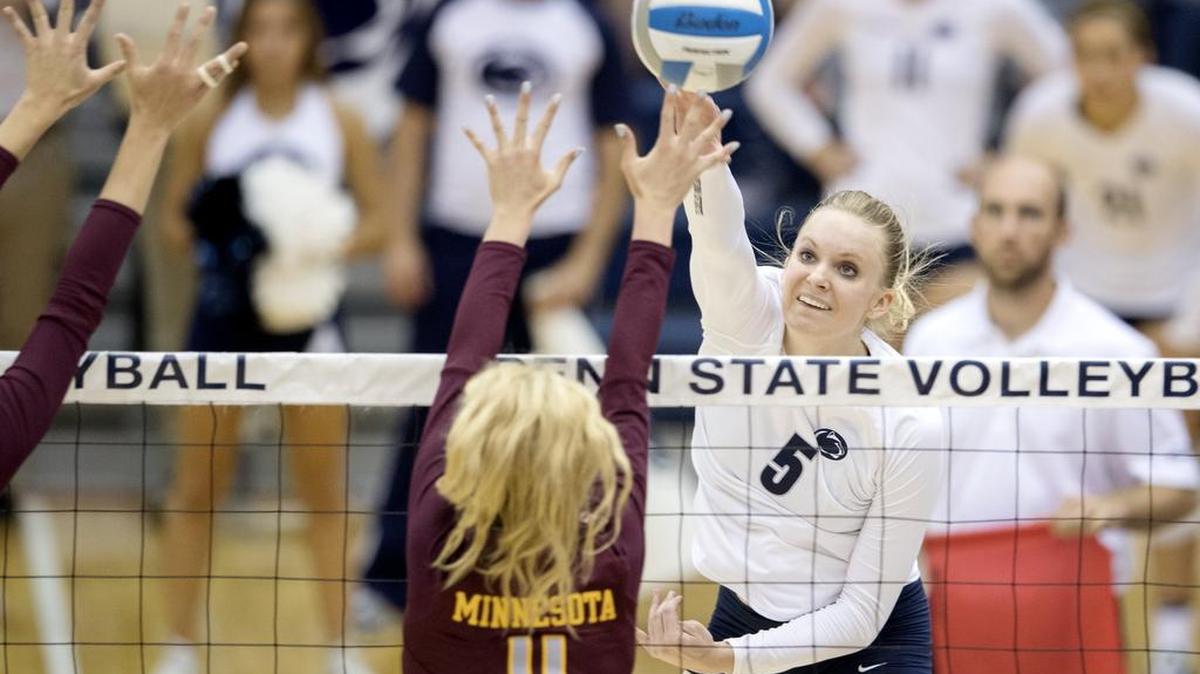 Penn State's Tori Morrell hits the ball over Minnesota's Samantha Seliger-Swenson during the match on Wednesday, October 5, 2016 in Rec Hall.