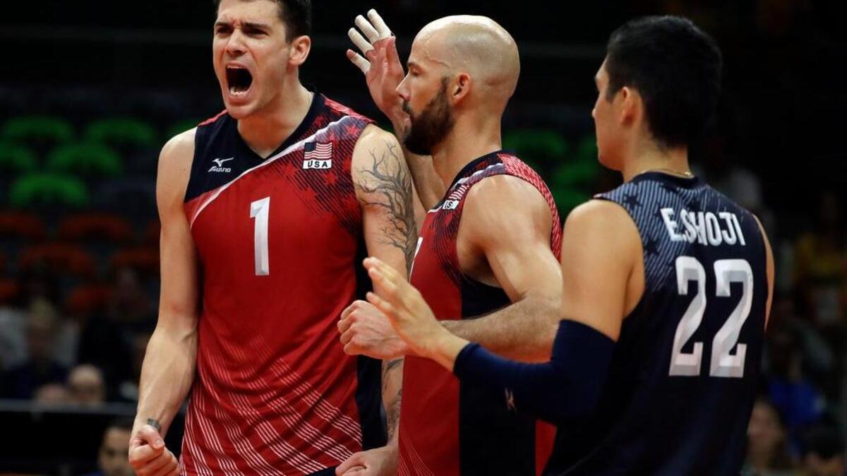 United States' Matthew Anderson (1), William Reid Priddy, center, and Erik Shoji celebrate during a men's bronze medal volleyball match against Russia at the 2016 Summer Olympics in Rio de Janeiro, Brazil, Sunday, Aug. 21, 2016. (AP Photo/Matt Rourke)