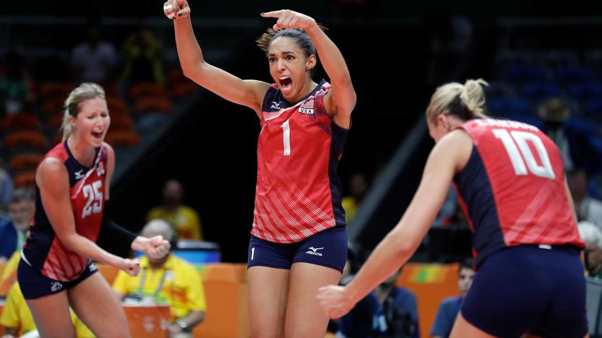 Former Penn State All-American and U.S. setter Alisha Glass, center, celebrates with teammates Karsta Lowe, left, and Jordan Larson-Burbach during a women's preliminary volleyball match at the 2016 Summer Olympics in Rio de Janeiro, Brazil, Friday, Aug. 12, 2016.