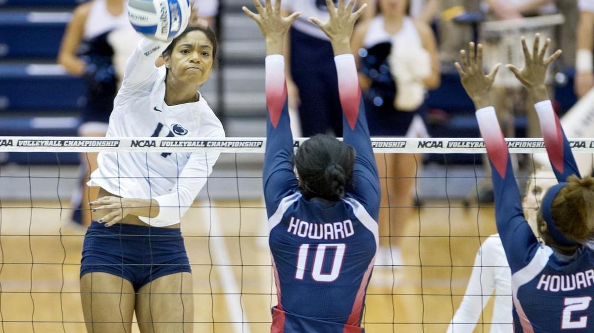 Penn State's Aiyana Whitney hits the ball past Howard's Khaila Donaldson during the Friday, December 4, 2015 NCAA women's volleyball tournament first round match.