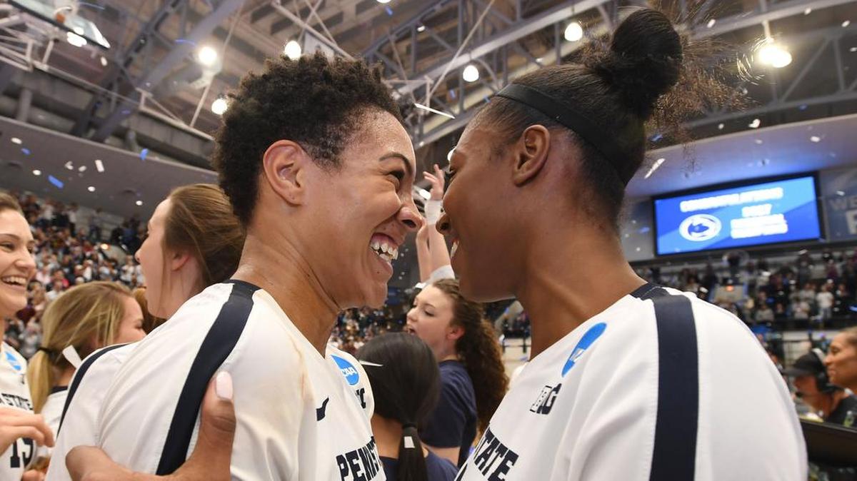 Penn State outside hitters Simone Lee, left, and Nia Reed hug in celebration after beating Michigan State in the NCAA Regional Championship Saturday, Dec. 9, 2017 at Rec Hall.