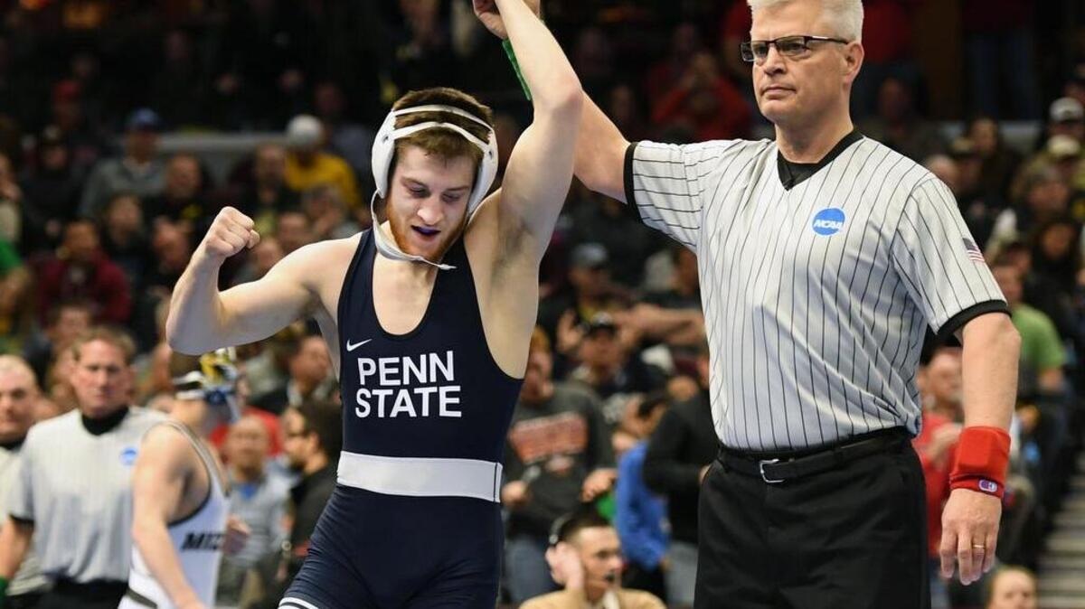 Penn State’s No. 8 Nick Lee celebrates after upsetting North Carolina State’s No. 5 Kevin Jack in their battle for fifth place at 141 pounds on Saturday in the fifth session of the NCAA Division I Wrestling Championships at Quicken Loans Arena in Cleveland.
