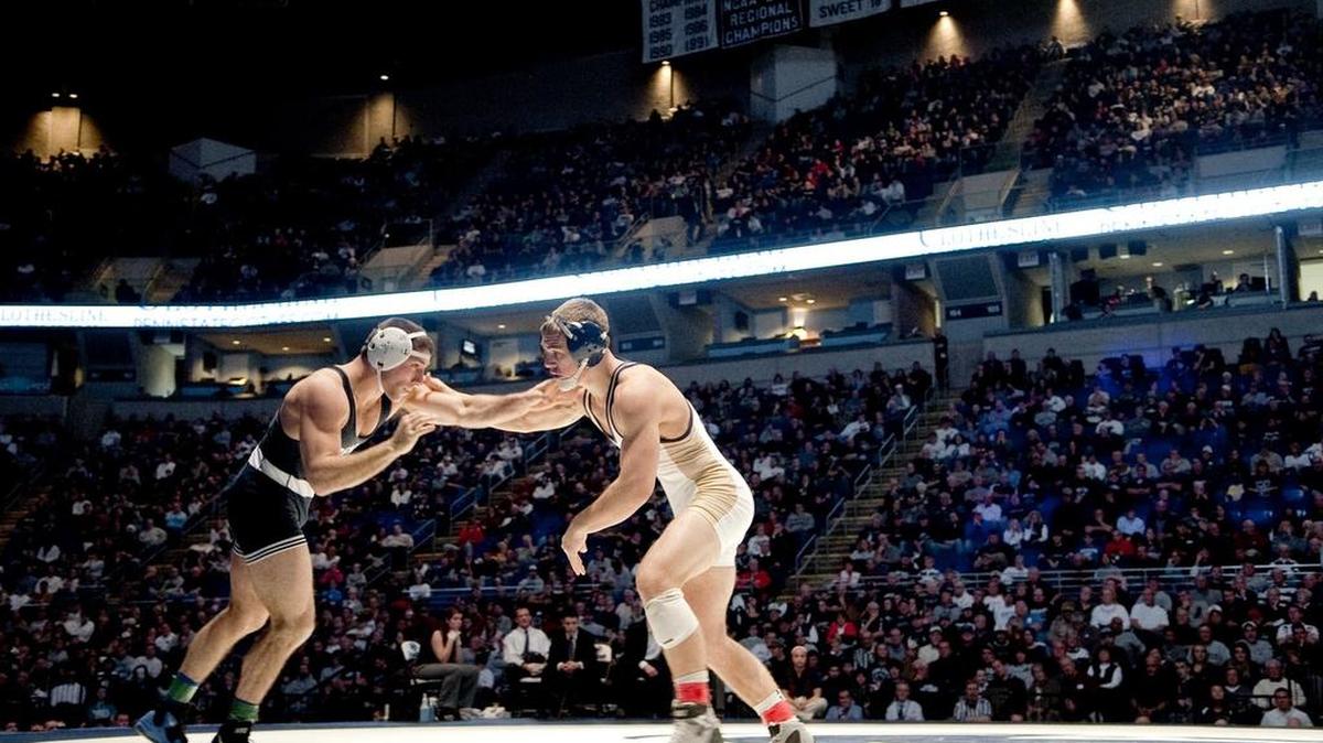 Penn State’s James Vollrath wrestles Pittsburgh’s Cole Sheptock in the 157-pound bout at the 2013 match in the Bryce Jordan Center. Vollrath died of cancer Friday.