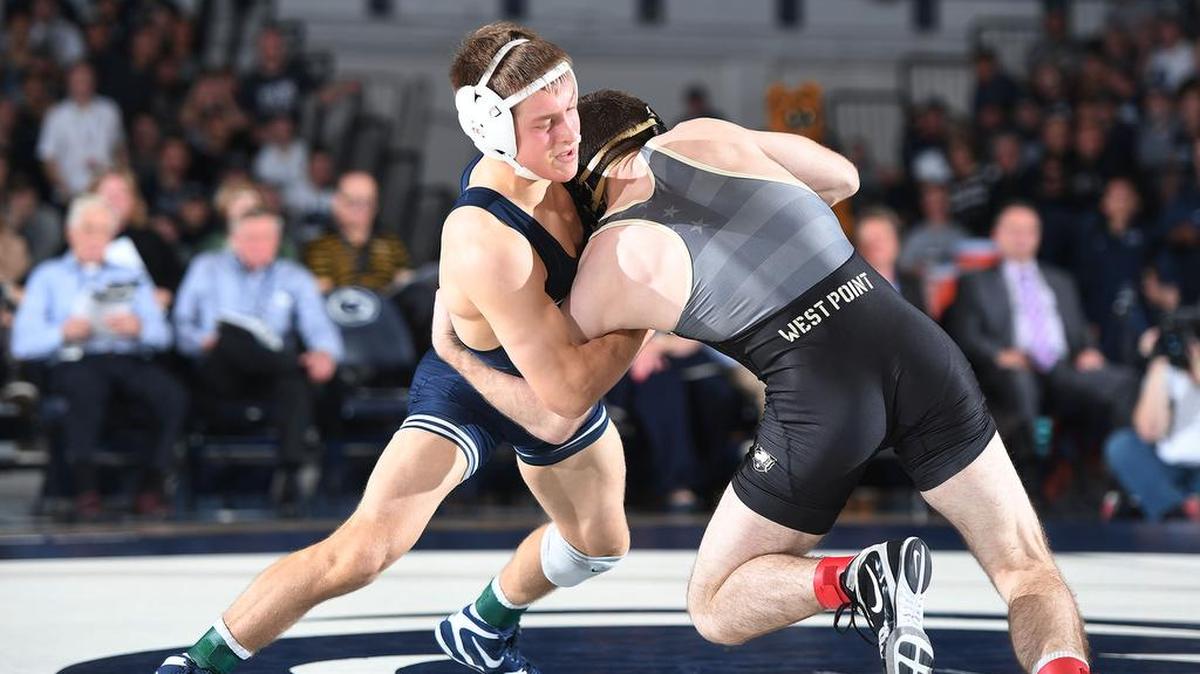 Penn State’s Devin Schnupp (left) locks up with Army’s Trey Chalifoux at 125 lbs Thursday at Recreation Hall. Chalifoux edged Schnupp, 6-4. Penn State defeated Army, 45-3.