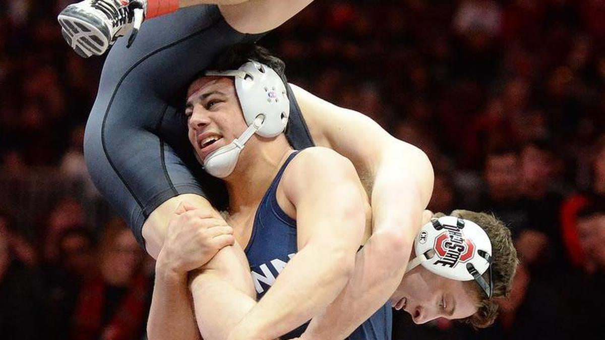 Penn State’s Vincenzo Joseph takes down Ohio State’s Cody Burcher at 165 pounds during a dual meet in Febrary. Joseph’s recent absence from the Nittany Lions’ lineup is raising questions about his health status.