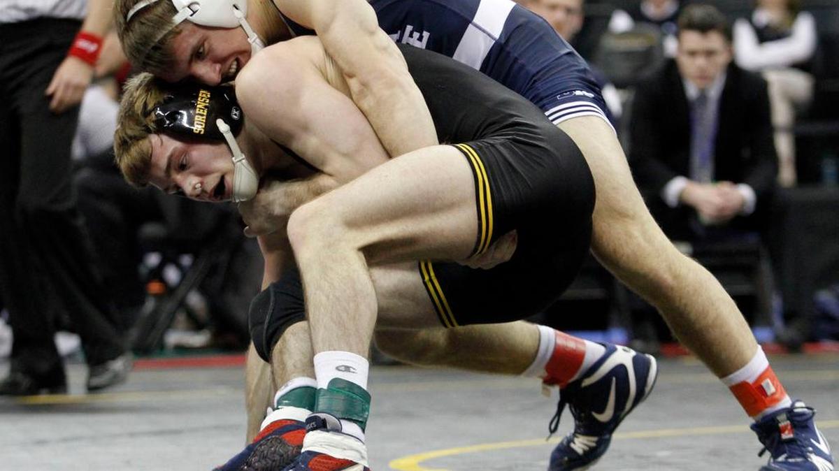 Penn State’s Zain Retherford, top, controls Iowa’s Brandon Sorensen in their 149-pound finals match during the Big Ten Championships at Carver Hawkeye Arena in Iowa City, Iowa, on Sunday. Retherford won 4-0.