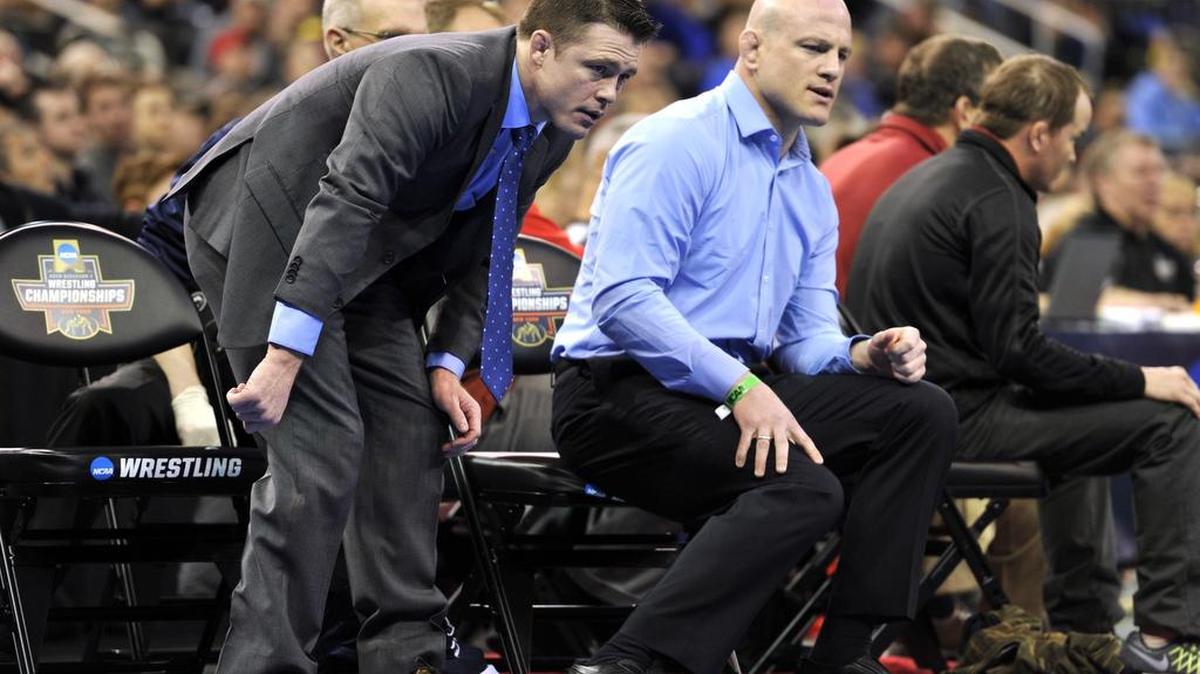 Penn State head coach Cael Sanderson, right, and assistant coach Cody Sanderson will look to lead the Nittany Lions to their sixth NCAA championship in seven years starting Thursday in St. Louis, Mo.