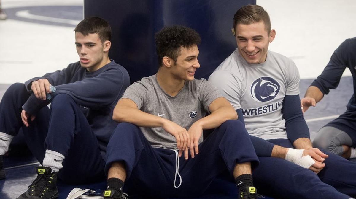 Penn State wrestler Justin Lopez (center) jokes with teammate Anthony Cassar (right) on Thursday, November 2, 2017 in the Lorenzo Wrestling Complex. Lopez is competing with Austin Clabaugh and Devin Schnupp for the starting 125-pound spot.