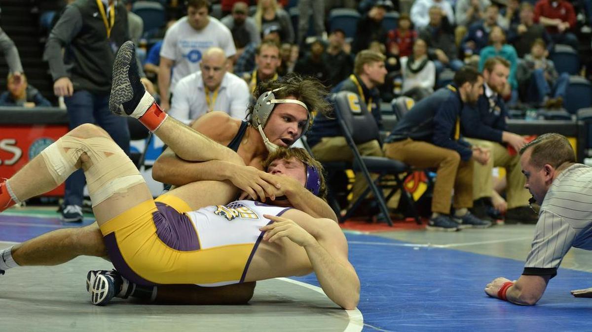 Penn State’s Shakur Rasheed cradles up Northern Iowa’s Jacob Holschlag in their 197-pound final bout during the Southern Scuffle on Tuesday. Rasheed, who was unseeded, pinned Holschlag in 46 seconds and was named the Outstanding Wrestler of the tournament.