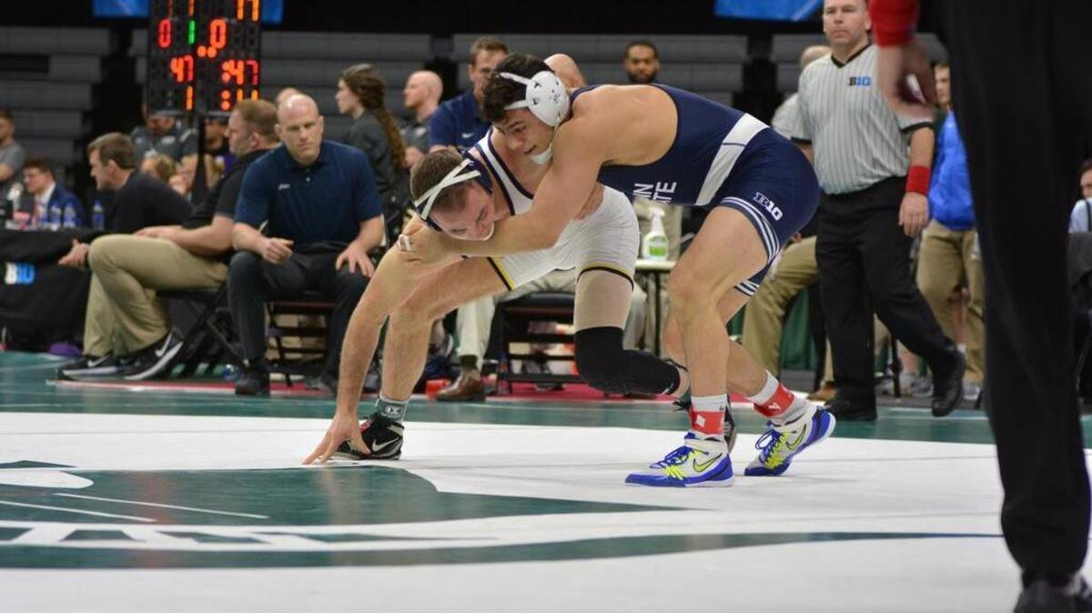 Penn State’s Vincenzo Joseph looks for positioning on Michigan’s Logan Massa in their 165-pound semifinals match on Satuday in East Lansing, Mich. Joseph topped Massa 5-4.