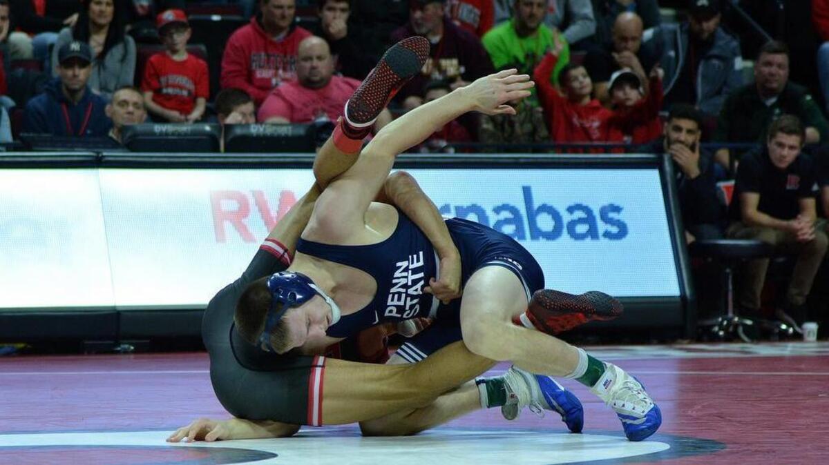Penn State’s Jason Nolf look for a takedown on Rutgers’ John Van Brill during their 157-pound bout during the Nittany Lions 25-15 win on Sunday. Nolf had to default with a right knee injury.