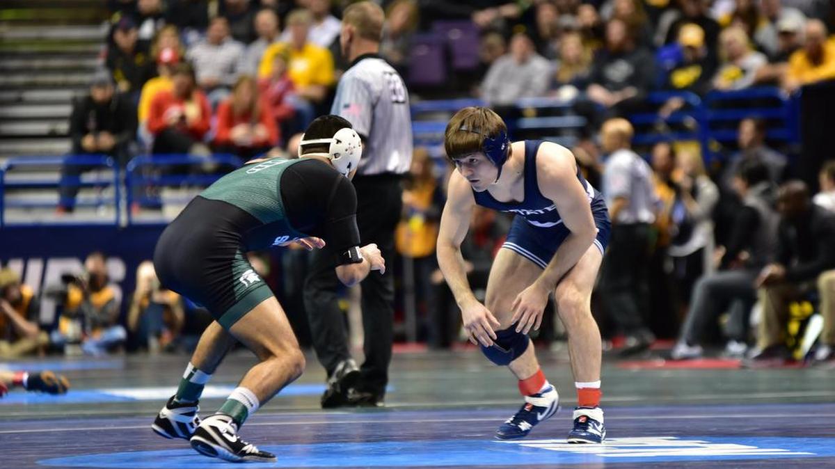 Penn State’s Jimmy Gulibon, right, looks for a shot on Michigan State’s Javier Gasca III in the first round of the 141-pound weight class of the NCAA championships on Thursday inside the Scottrade Center in St. Louis, Mo. Gulibon won 18-3.