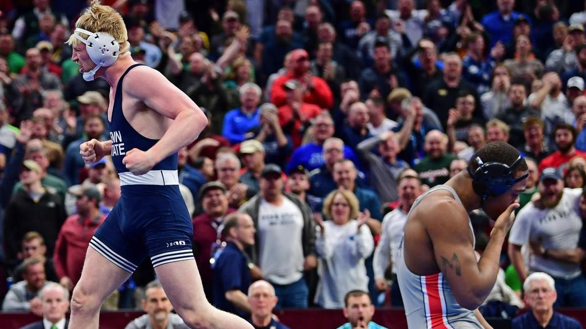 Penn State’s Bo Nickal, left, celebrates after pinning Ohio State’s Myles Martin during the 184-pound championship match of the NCAA Division I Wrestling Championships, Saturday, March 17, 2018, in Cleveland.