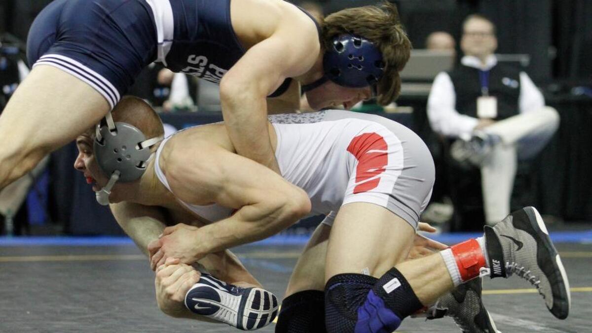 Penn State’s Jimmy Gulibon, left, competes with Ohio State’s Micah Jordan in their 141-pound quarterfinal match during the Big Ten Championships in Iowa City, Iowa, on Saturday. Gulibon won 3-2.