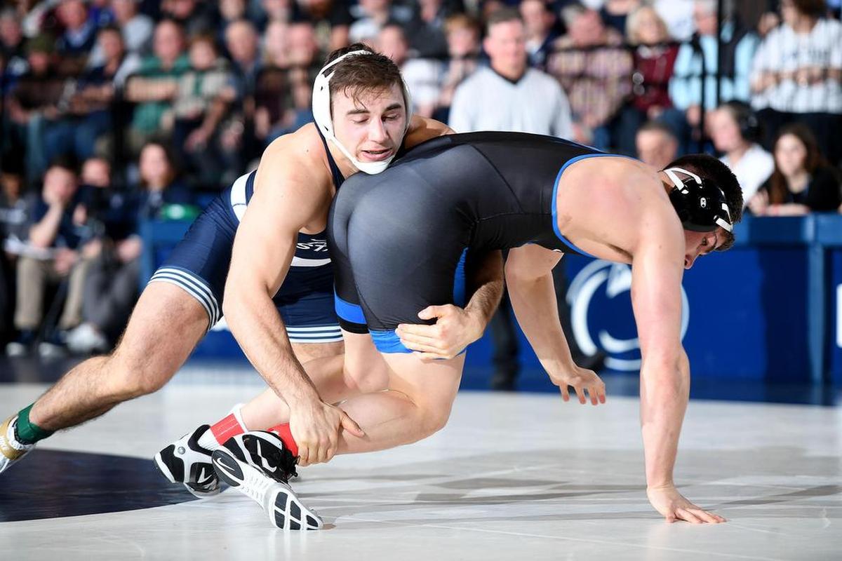 Penn State’s Anthony Cassar (left) takes down Buffalo’s Sam Schuyler at 285 lbs Sunday at Recreational Hall. Cassar defeated Schuyler, 16-5. Penn State defeated Buffalo, 47-3.