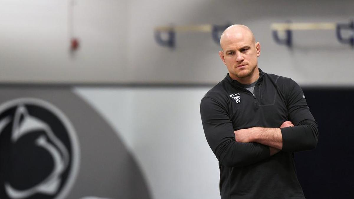 Penn State wrestling coach Cael Sanderson watches over practice on Monday at the Lorenzo Wrestling Complex as his wrestlers get in their last-minute workouts before heading to Cleveland, Ohio for the 2018 NCAA Wrestling Championships.