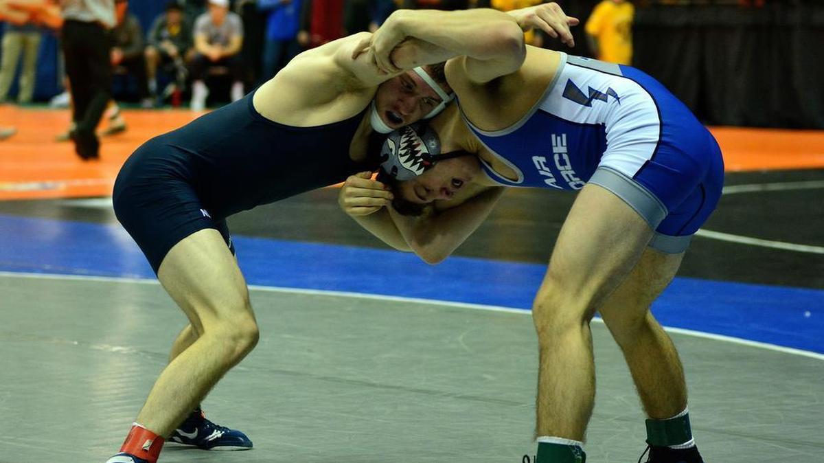 Penn State’s Nick Lee, who is wrestling unattached, looks for position on Air Force’s Garrett O’Shea in their 141-pound second round match of the Southern Scuffle on Monday. Lee earned an 18-3 technical fall in 4:55.