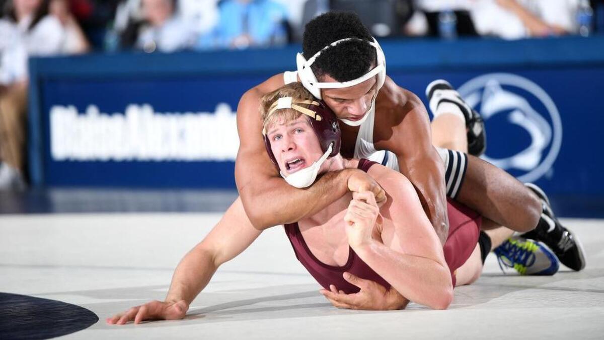 Penn State’s Mark Hall (top) holds Minnesota’s Chris Pfarr to the mat during their 174-pound match at Rec Hall on Friday.