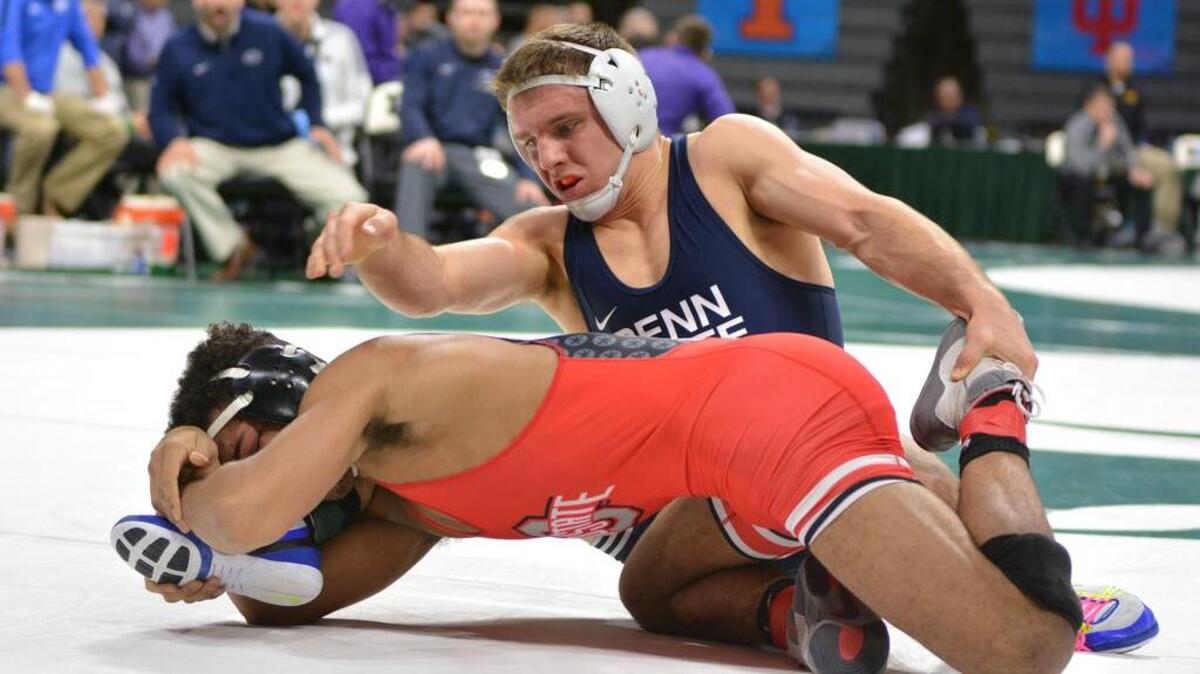 Penn State’s Zain Retheford scrambles with Ohio State’s Ke-Shawn Hayes in their 149-pound semifinals match of the Big Ten Wrestling Championships on Saturday in East Lansing, Mich. Retherford topped Hayes 10-0.